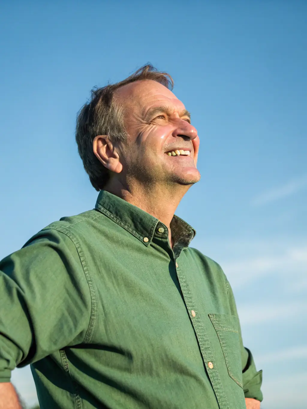 A person smiling confidently, knowing they have Hospital Indemnity Insurance to protect their financial well-being during a health crisis.
